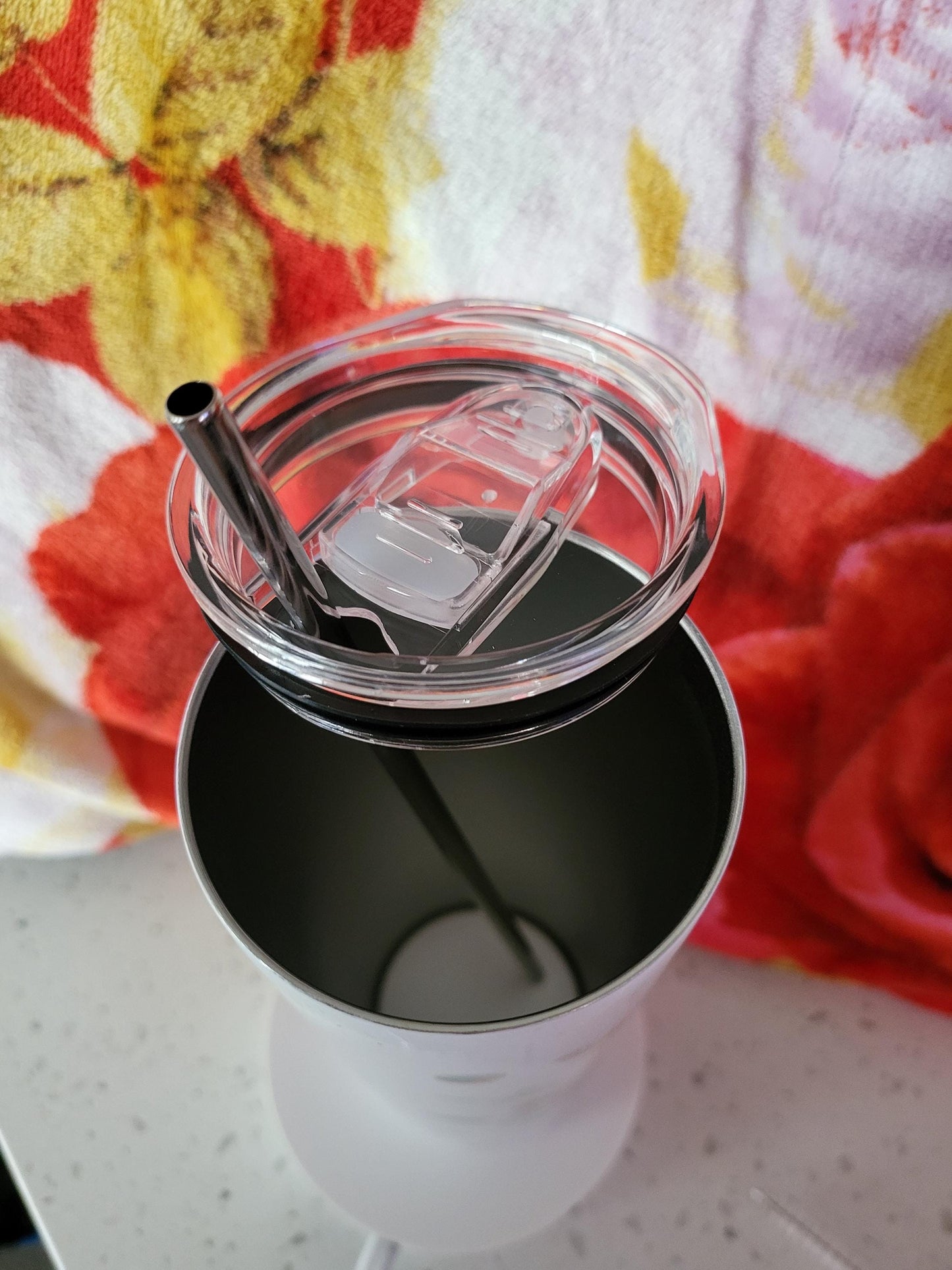 Personalized 20oz Insulated Tumbler featuring a vibrant, colorful floral design.